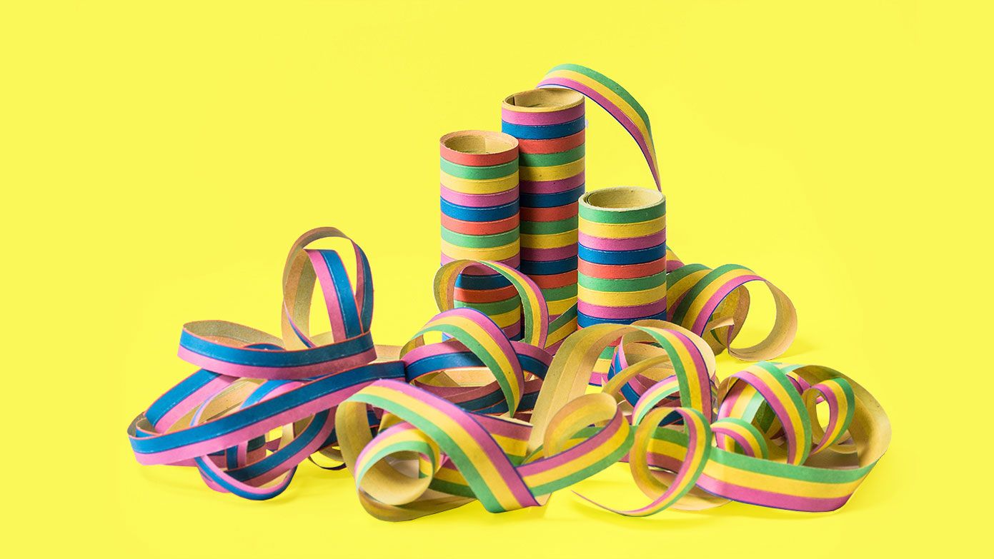 Multi coloured party string on a yellow background